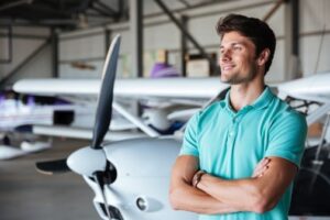 Man next a private jet.