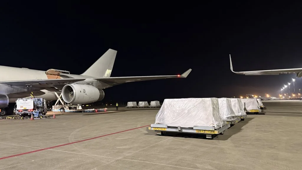 Cargo pallets are waiting to be loaded to the aircraft.