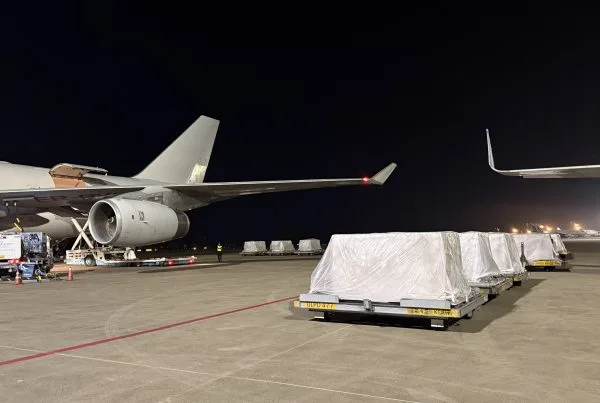 Cargo pallets are waiting to be loaded to the aircraft.